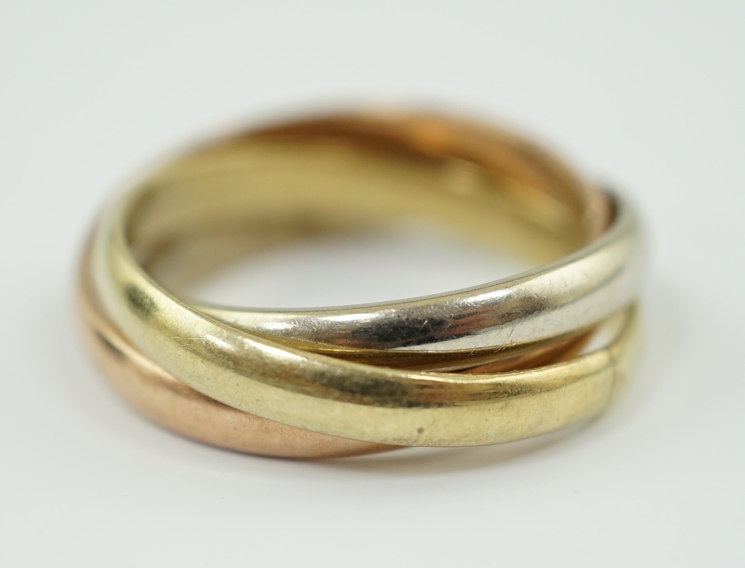 A modern three colour 14k gold 'Russian' wedding ring